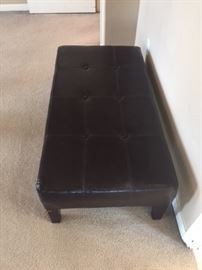 leather like dark brown ottoman about 2 x 4 feet and 18 inches tall