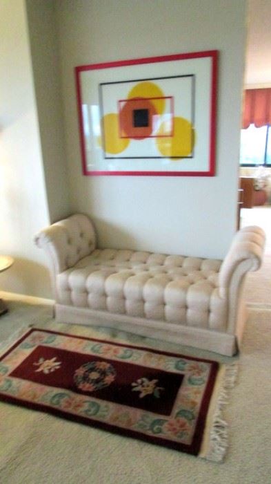 Reverse painted glass in red aluminum frame, stufted settee. Chinese wool area rug