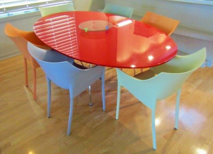 Table and chairs by Kartell
