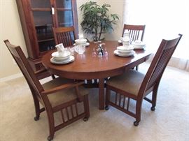 Arts and Crafts table (round to oval) with four matching chairs. Pink and blue ST china for 8 plus extras. THree Fenton bells. Artificial palm