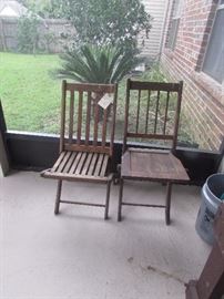 Two wooden vintage folding chairs