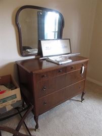 Matching dresser and mirror with full size bed