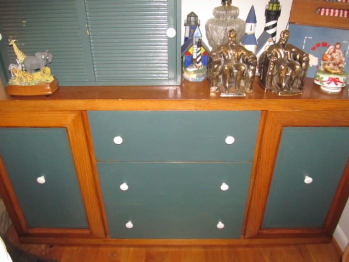 Buffet with drawers and cabinet door painted green. The green piece on top is separate
