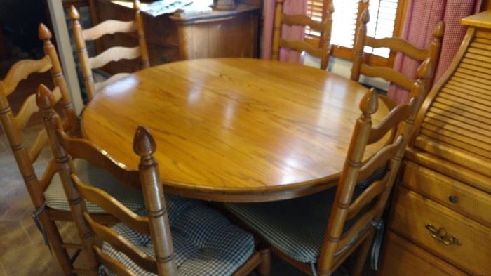Oak round table with 2 leaves and claw feet-6 ladderback chairs sold separately
