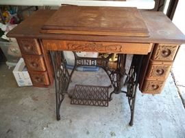 Singer machine and cabinet.  We will check the machine out soon!