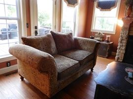 one  of  two  paisley  love  seats-