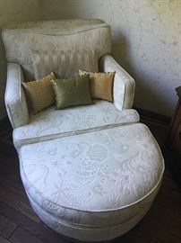 Beautiful upholstered armchair and ottoman.