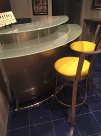 Modern stainless steel bar and bar stools.