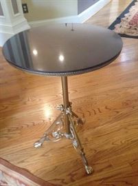 Marble top side table with adjustable height.