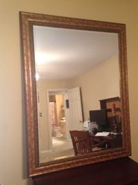 Large gold-framed mirror with beveled glass