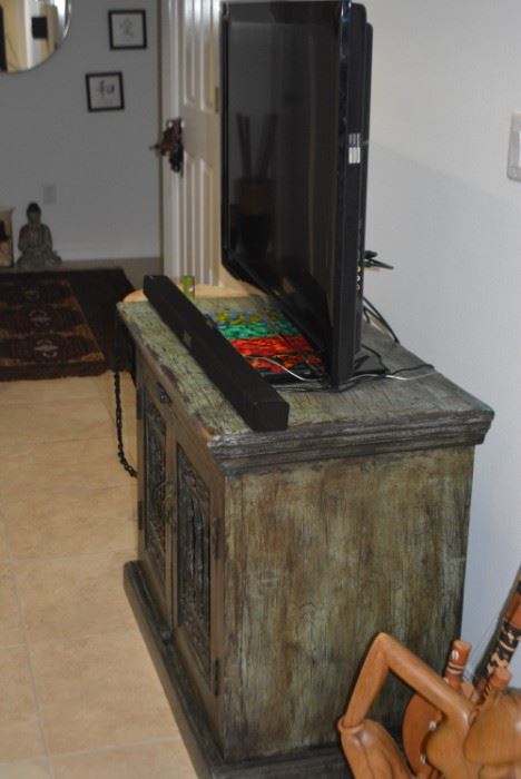 This real wood cabinet is a versatile piece that will last a lifetime! Use as an entertainment center, cabinet for kitchen, or storage for clothes or any storage you’d like. Details: Distressed Green Wood in Color; Condition: Excellent; Size: 36" x 20"