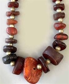 Dark amber large beads from  Eastern European late 18th/ early 19th c strung  with later silver beads. 