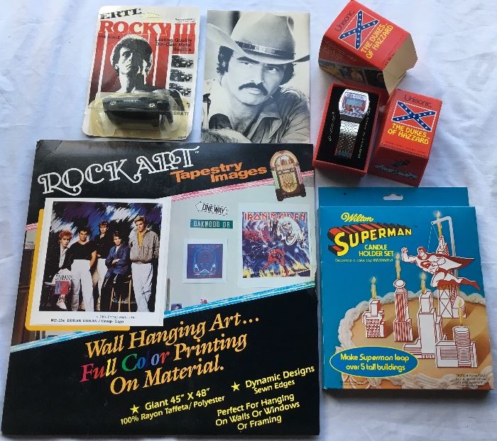 Never used / Deadstock items in quantity including Burt Reynolds Cards, Superman items, Dukes of Hazard Watches, Rocky Cars