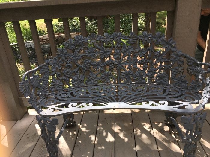 Lots of wrought iron outdoor furniture