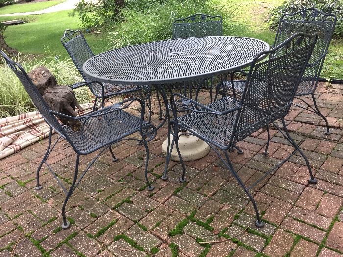Round wrought iron table and chairs
