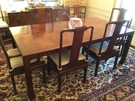 Asian flare Henredon matching dining table 80L x 42" W with two arm chairs, 6 armless chairs, two leaves and protective pads.   Beyond spectacular.   