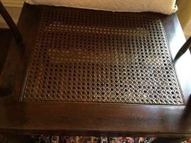 Cane seat under cushion closeup