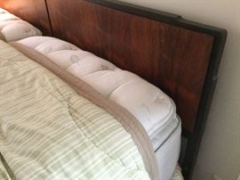 Corner view of headboard.  The mattress is extremely high which covers a lot of the headboard.