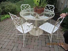 Patio set metal Asian flair chairs with glass topped table