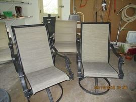 outdoor patio / fire pit, comfortable chairs, and side tables