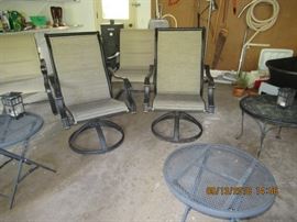 outdoor patio / fire pit, comfortable chairs, and side tables