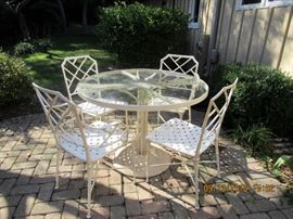 Patio set metal Asian flair chairs with glass topped table