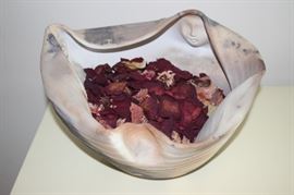 Signed bowl with faces inlaid.