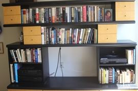 Hard backs and paperbacks. Bookshelf entertainment unit.