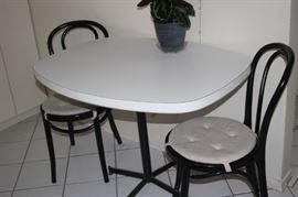 Kitchen table and two chairs.