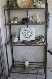 Outdoors bakers rack and ceramics.