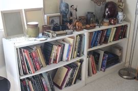 Frames, bookcases, floor lamp, ceramics, brass and wood figures.