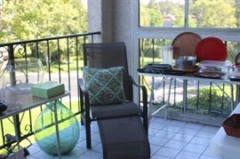 Balcony with vases, platters, plastics, trays.