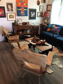 A very eclectic collection of furniture, art, and decor. Blue sofa with large nail head trim by H M Richards (Please read the terms and conditions regarding our sales) Set up and Photo by BC