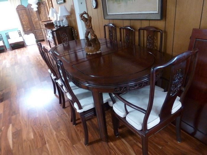 Solid rosewood dining table with 8 chairs and 2 leaves