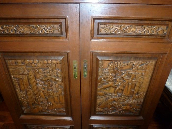 Closer picture of front carving of liquor cabinet. Back also carved