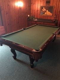 Gorgeous Pool table with mother of pearl inlay.  This table is on the low level and would be ideal to move straight out the door with no steps and onto a truck!