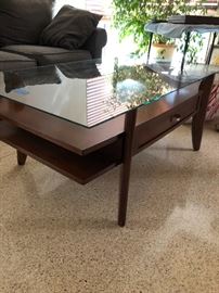 Mid Mod style coffee table.  In excellent condition with no scratches in the glass.  Come and get it!