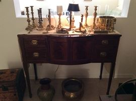 Antique Federalist style Sideboard or Buffet,  Mahogany, shown with a collection of brass....
