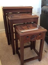 Carved Relief Top Oriental Nesting Tables....