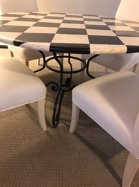 Iron 48" round table with black and white top with 4 white side chairs 
