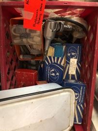 filled large crate of several different polishing stones