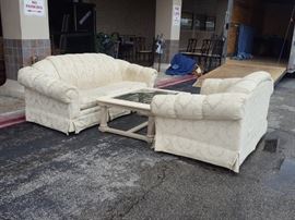 Cream sofa, loveseat and coffee table