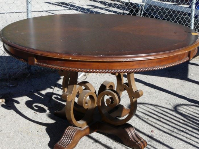 This table is lovely with its metal base and dark stain.