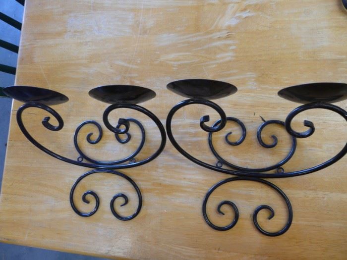 We have a dozen or so wrought iron candle holders, some in pairs, some not.