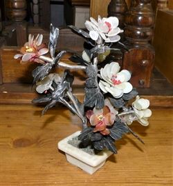 We have no idea why this is in the warehouse, but it's for sale; gemstone bonsai "plant".