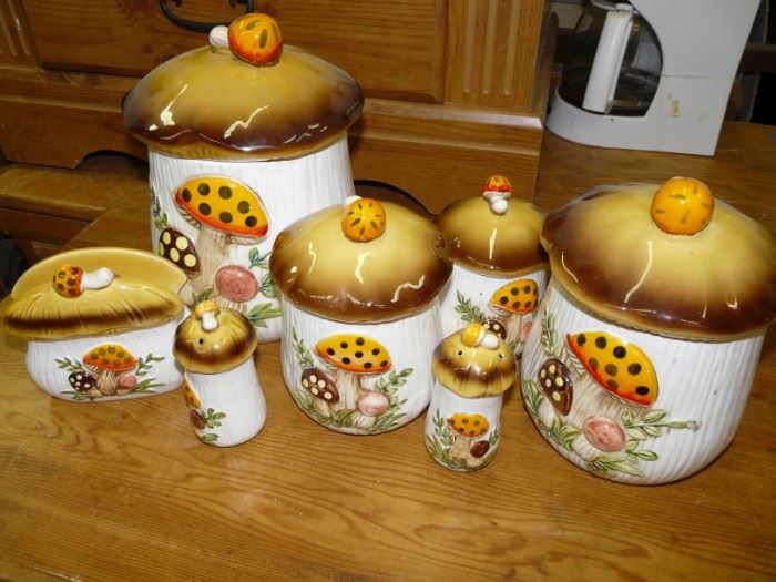 Set of 4 canisters, a salt and pepper shaker, and a napkin holder in pristine condition in the Merry Mushroom pattern, made in Japan Sears and Roebuck.