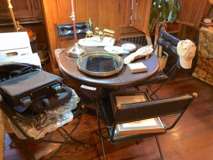 Round Table and Chairs with Assorted Household Items