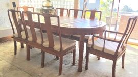 Chinese Rosewood Dining Table and 8 Chairs, Decorated with Carved Shou (Longevity And Prosperity). Table has 2 Leaves.