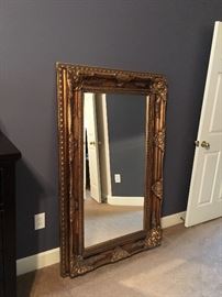 Large gold tone framed mirror.