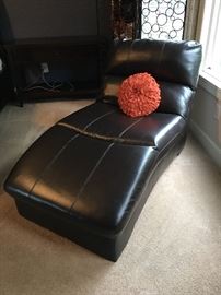 Pleather chaise/lounge chair by Ashley furniture, in excellent condition. Black.